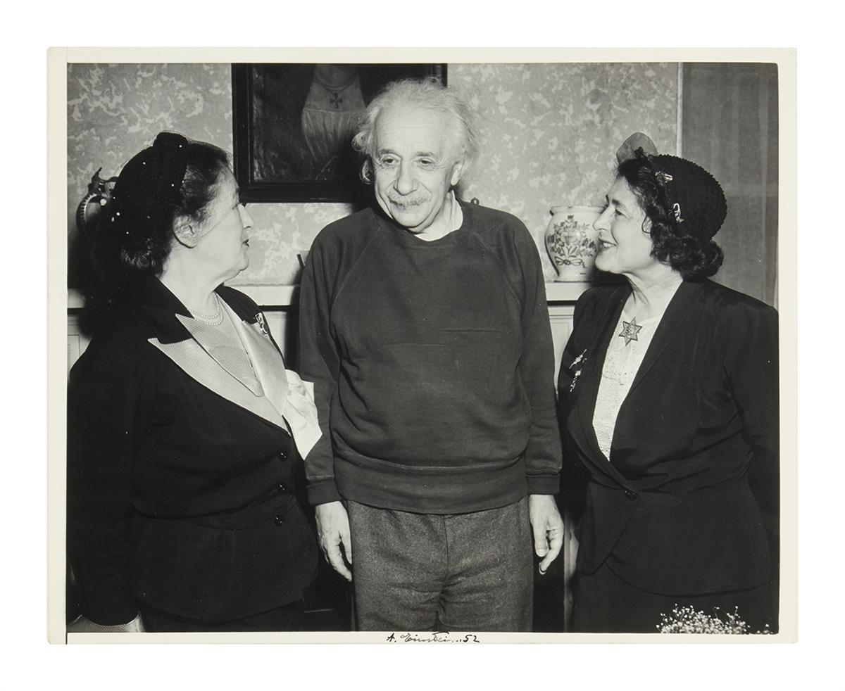 (SCIENTISTS.) EINSTEIN, ALBERT. Photograph Signed, A. Einstein. 52, half-length group portrait showing him standing between Talmudic